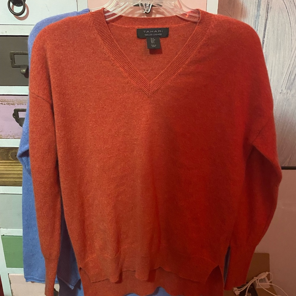 100% cashmere sweater, a pretty orange. Tag says medium, fits like a small.
